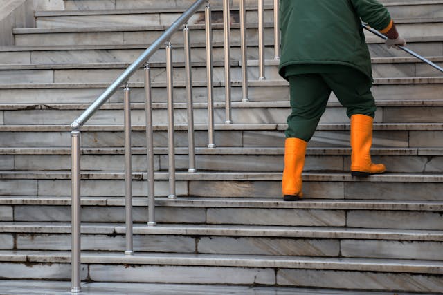 Cleaner maintaining building stairs and common areas